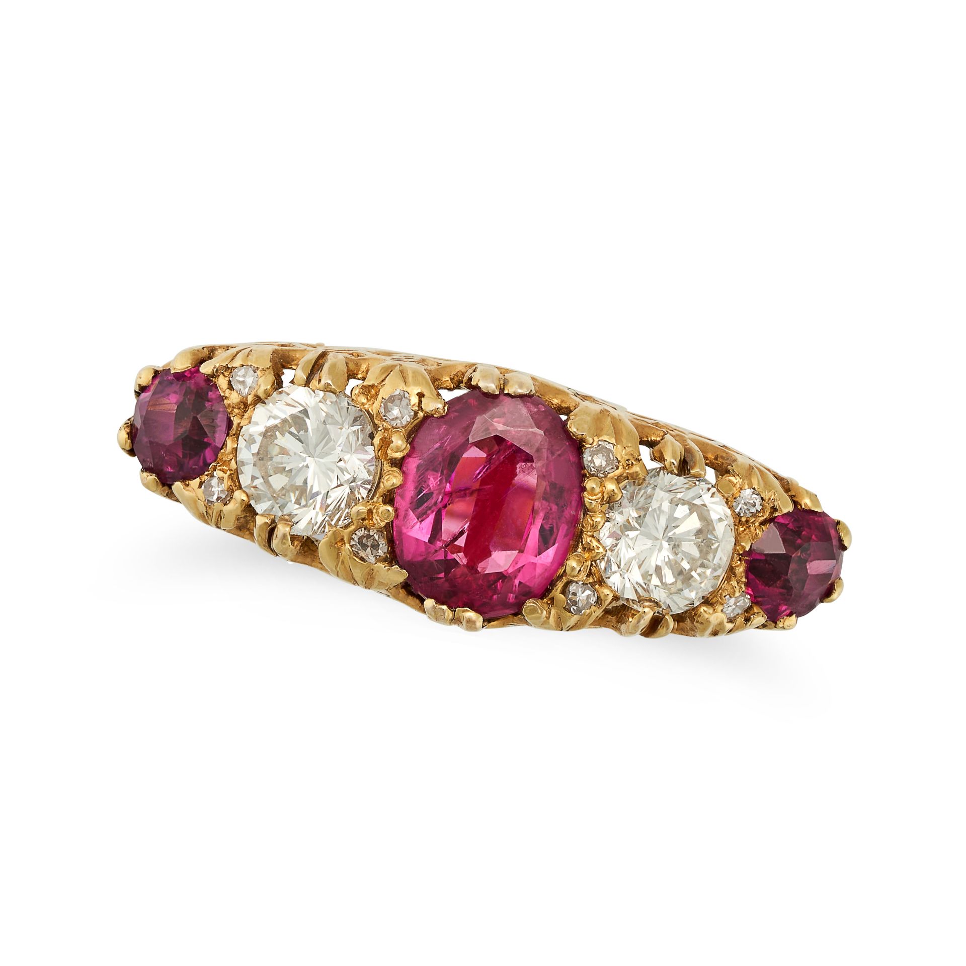 A FIVE STONE RUBY AND DIAMOND RING in yellow gold, set with cushion and round cut rubies accented...