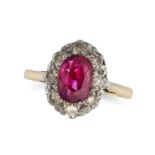 A RUBY AND DIAMOND CLUSTER RING in 18ct yellow gold, set with an oval cut ruby of approximately 1...