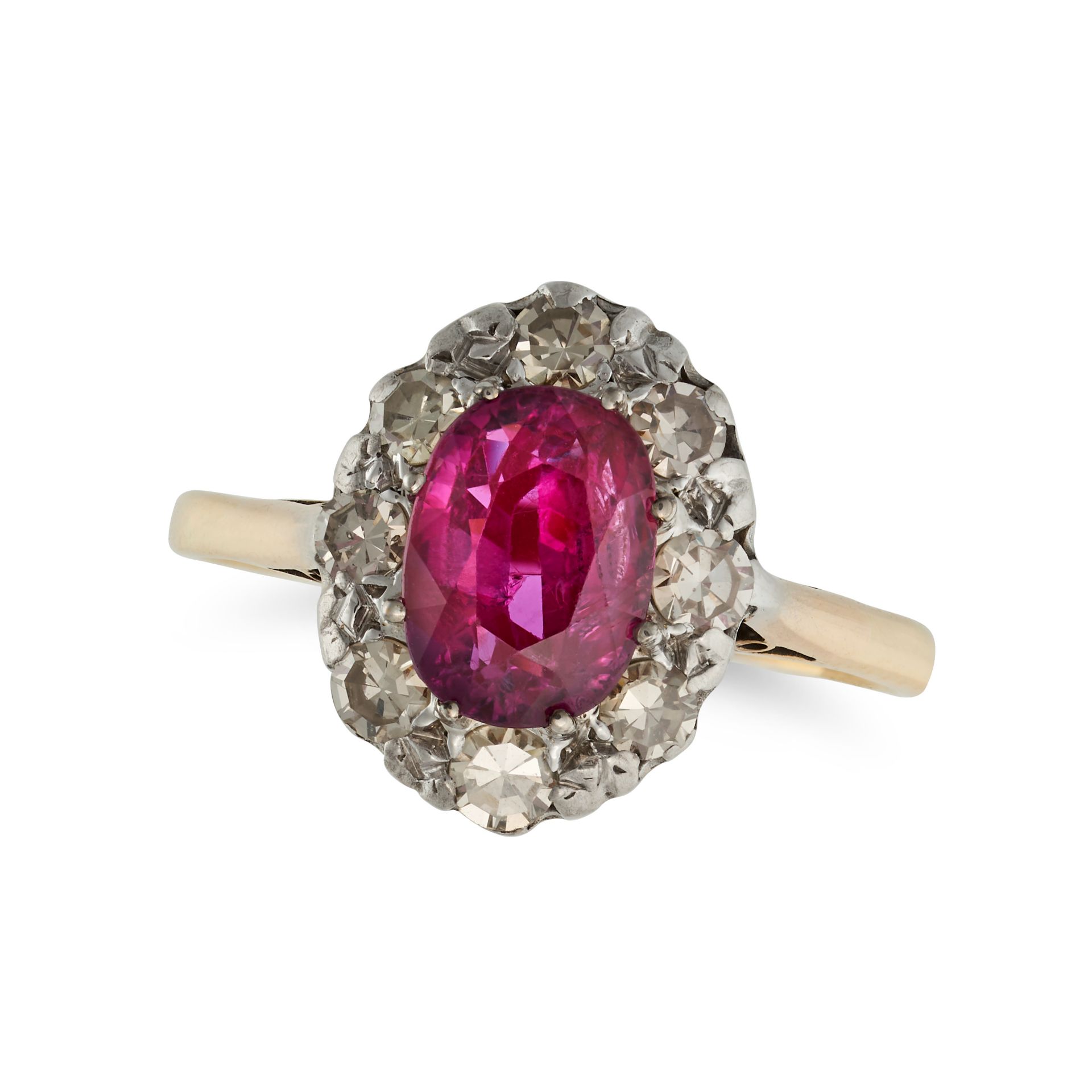 A RUBY AND DIAMOND CLUSTER RING in 18ct yellow gold, set with an oval cut ruby of approximately 1...