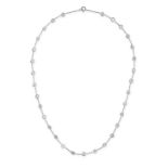 A DIAMOND CHAIN NECKLACE in platinum, comprising a trace chain set with round brilliant cut diamo...