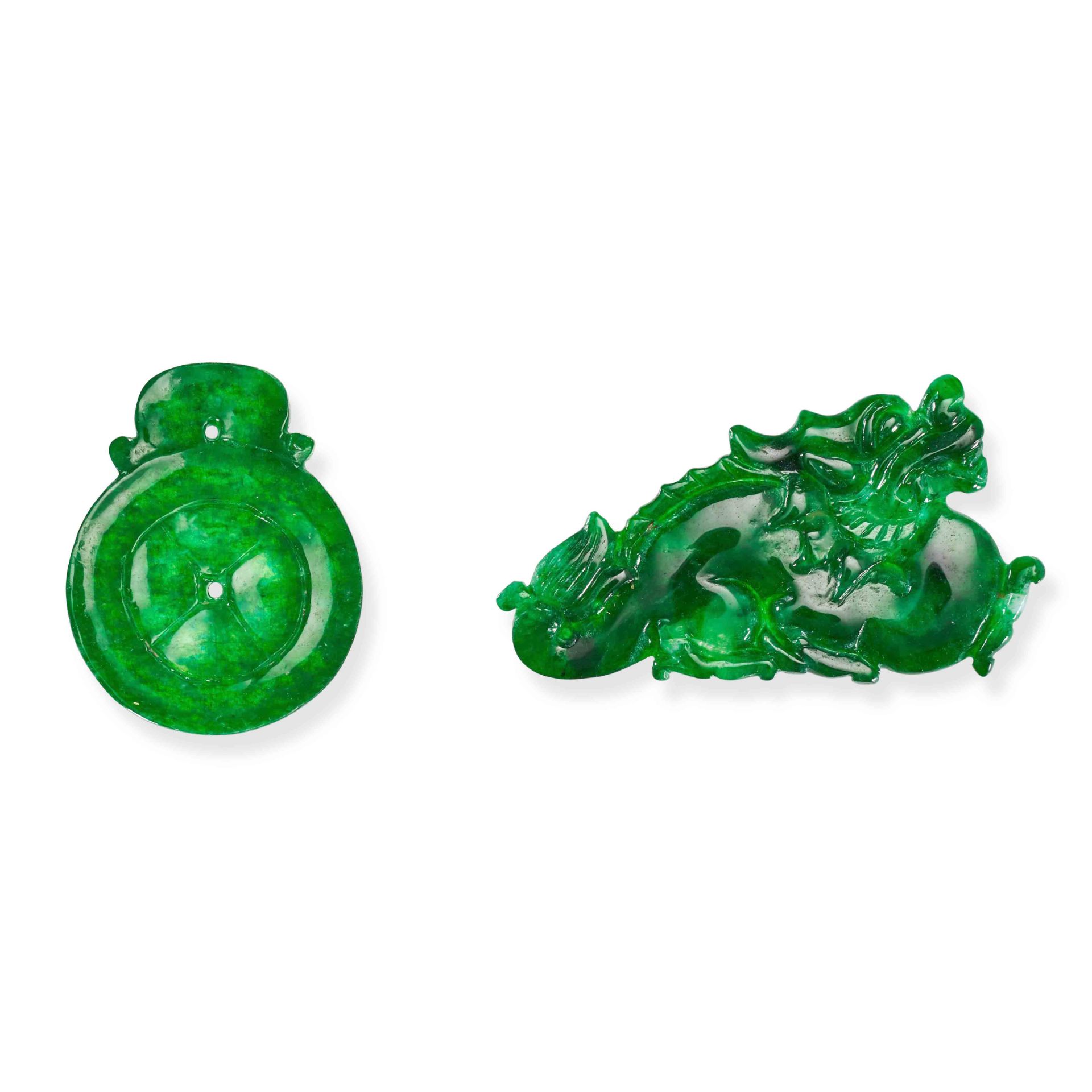 TWO UNMOUNTED JADEITE JADE PLAQUES carved to depict foliage and a disc, 2.4cm, 1.7cm, 1.2g.