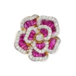 A RUBY AND DIAMOND FLOWER RING in 18ct yellow and white gold, designed as a flower set with taper...