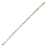 A DIAMOND LINE BRACELET in 18ct yellow gold, set with a row of baguette cut diamonds, the diamond...