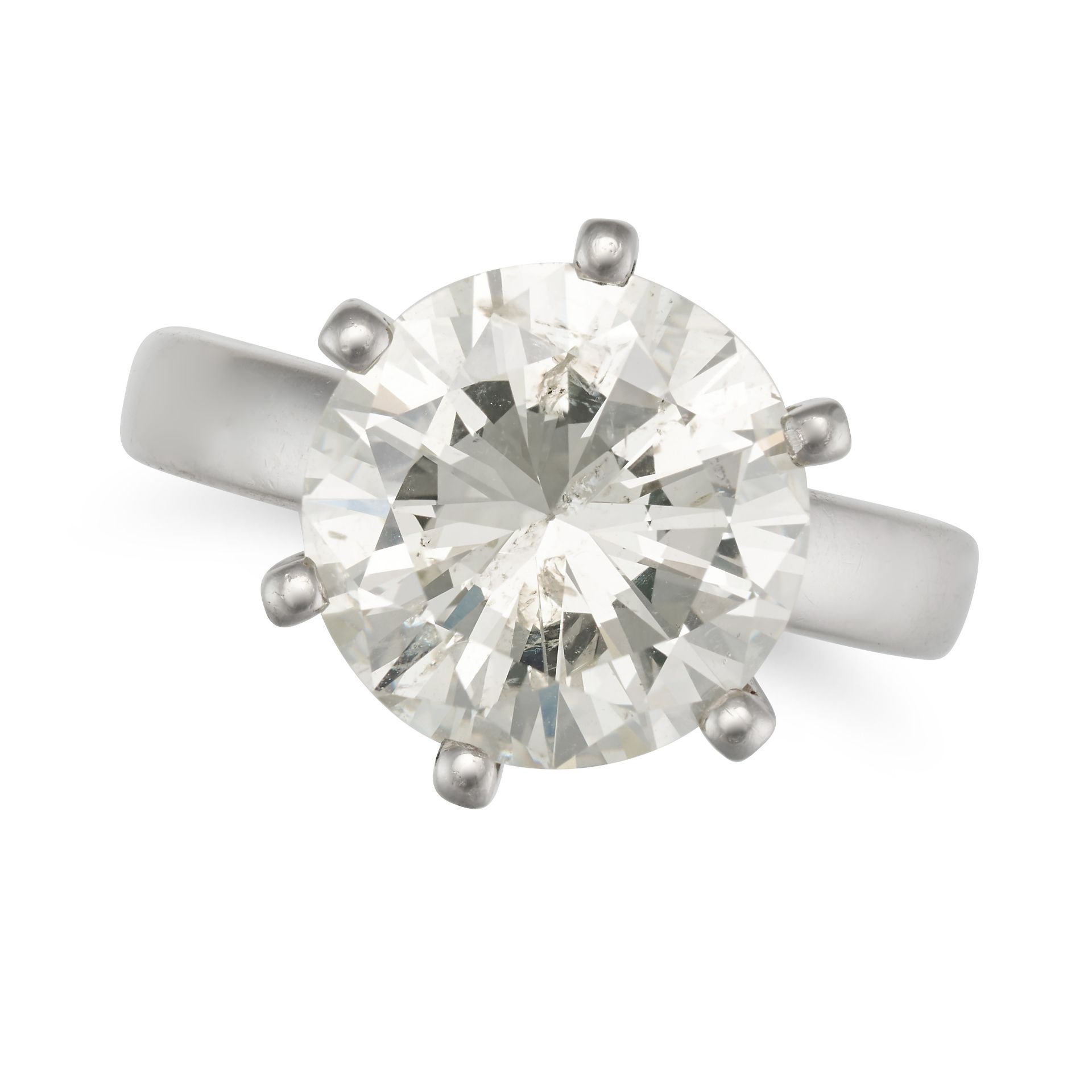 A SOLITAIRE DIAMOND RING in platinum, set with a round brilliant cut diamond of 5.68 carats, stam...