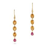 A PAIR OF CITRINE AND RUBY DROP EARRINGS in 14ct yellow gold, each comprising a row of oval cut c...