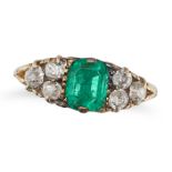 AN ANTIQUE EMERALD AND DIAMOND RING in 18ct yellow gold, set with an octagonal step cut emerald o...