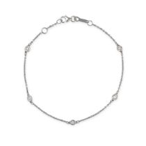 NO RESERVE - A DIAMOND BRACELET in 18ct white gold, comprising a trace chain set with round brill...