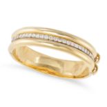 A DIAMOND BANGLE in 18ct yellow gold, set with a row of round brilliant cut diamonds, the diamond...