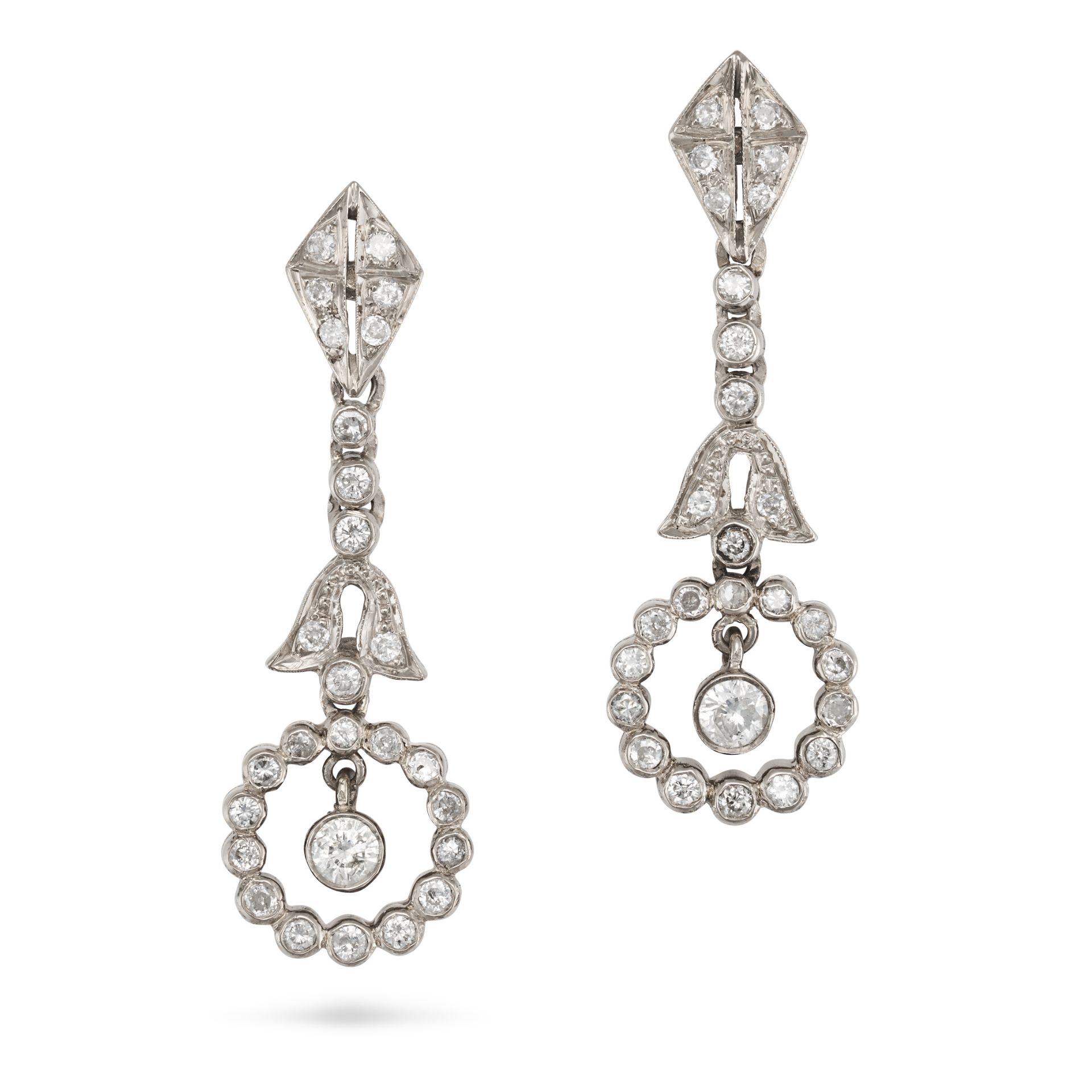 A PAIR OF DIAMOND DROP EARRINGS in white gold, each comprising a row of round cut diamonds, suspe...