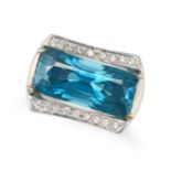 A BLUE ZIRCON AND DIAMOND DRESS RING in 18ct white gold, set with an elongated cushion cut blue z...