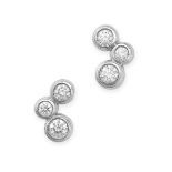 TIFFANY & CO., A PAIR OF DIAMOND BUBBLE EARRINGS in platinum, each set with three round brilliant...