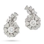 A PAIR OF DIAMOND CLIP EARRINGS in platinum, each set with a round brilliant cut diamond of appro...