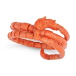 AN ANTIQUE CARVED CORAL DRAGON BANGLE designed as a coiled dragon, the body formed of a series of...