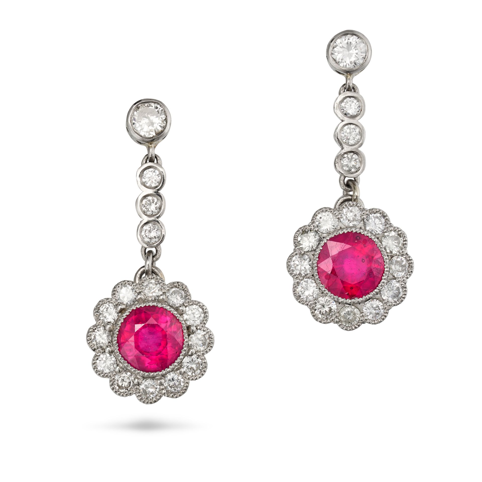 A PAIR OF GLASS-FILLED RUBY AND DIAMOND CLUSTER DROP EARRINGS in platinum, each comprising a row ...