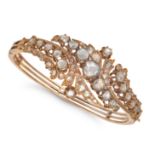 AN ANTIQUE DIAMOND BANGLE in yellow gold, the hinged bangle in foliate design, set throughout wit...