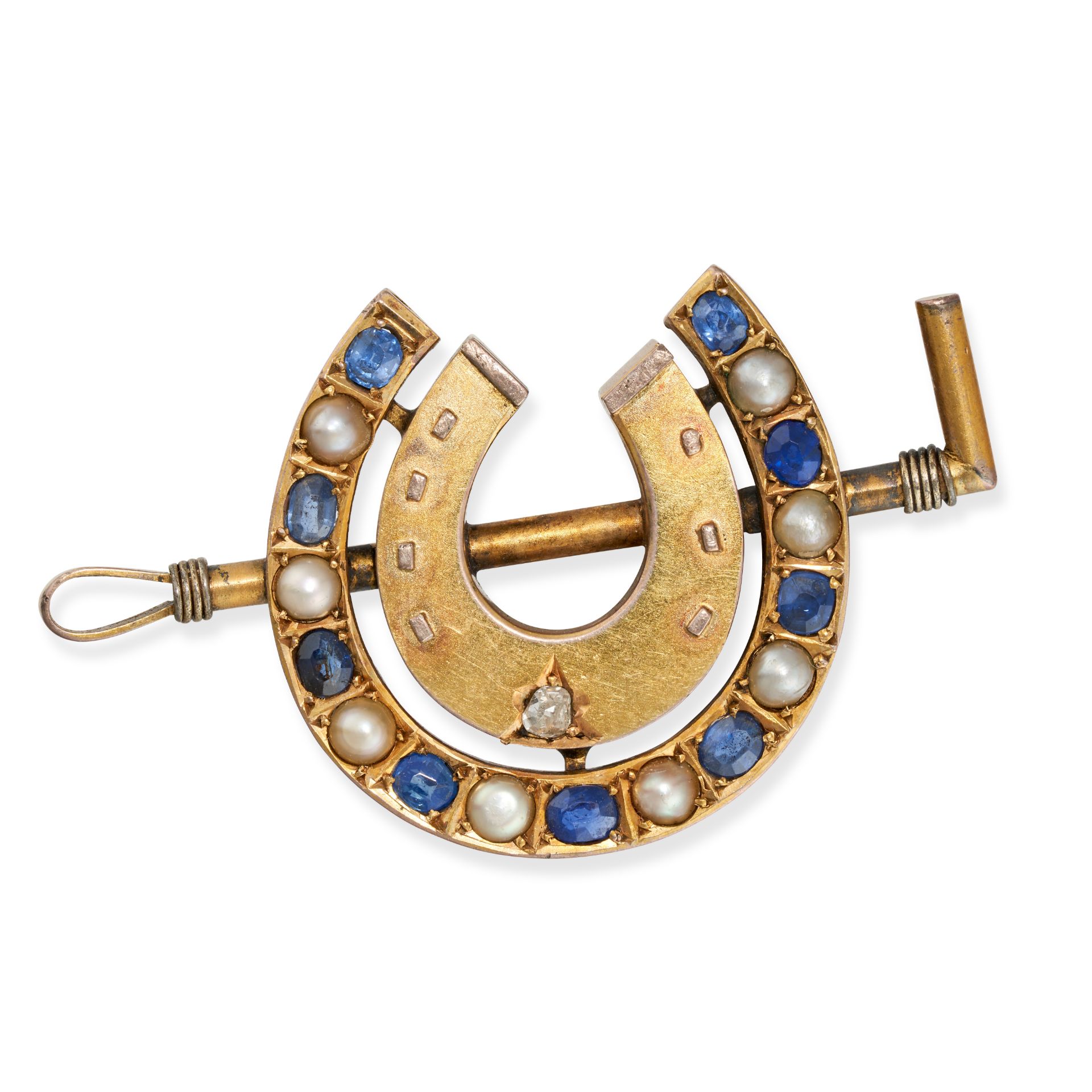 AN ANTIQUE SAPPHIRE, PEARL AND DIAMOND HORSESHOE AND RIDING CROP BROOCH designed as a horseshoe s...
