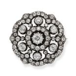AN ANTIQUE DIAMOND SNOWFLAKE BROOCH in yellow gold and silver, designed as a stylised snowflake s...