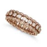 A DIAMOND ETERNITY RING in yellow gold, set with a row of round brilliant cut diamonds accented b...