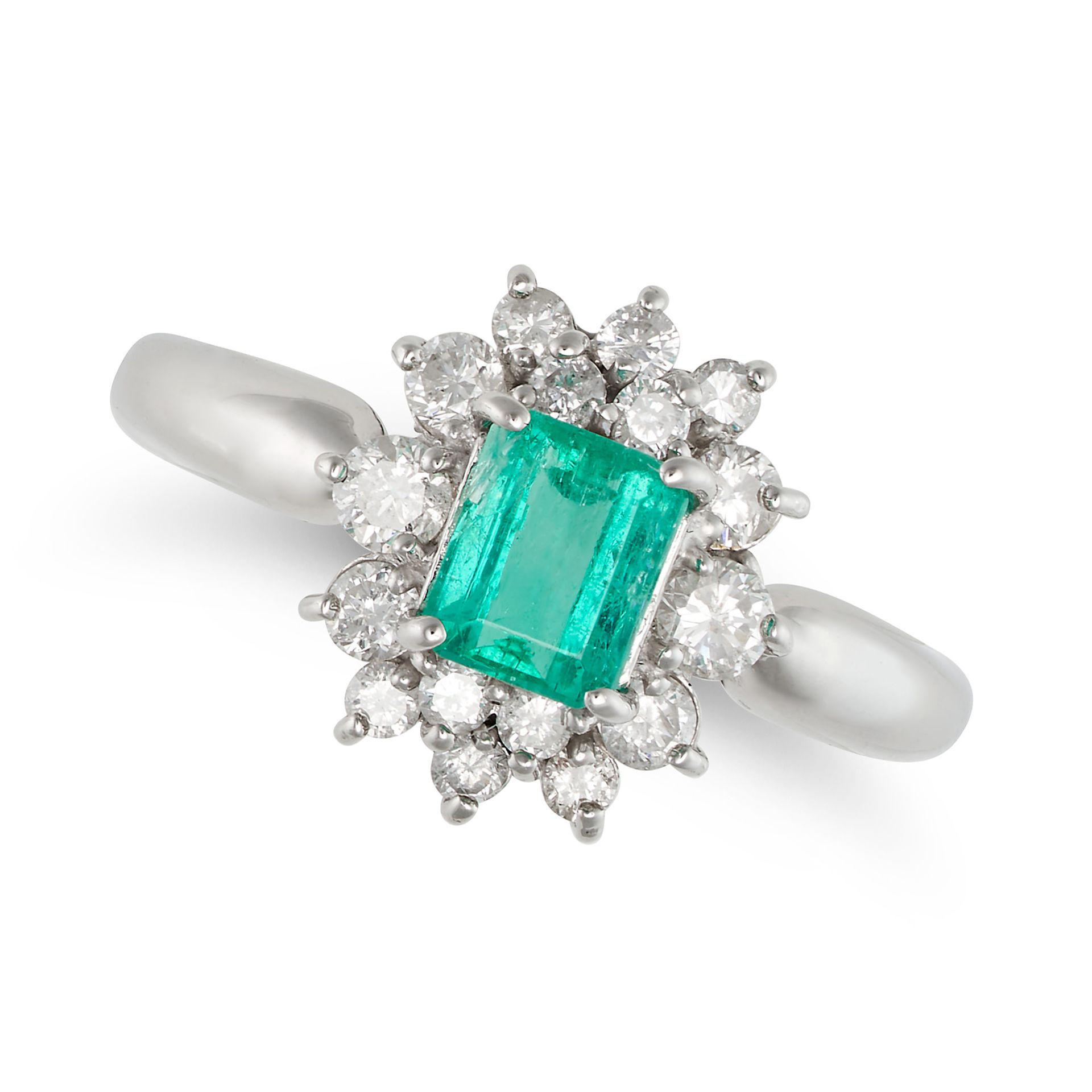 A COLOMBIAN EMERALD AND DIAMOND CLUSTER RING in platinum, set with an octagonal step cut emerald ...