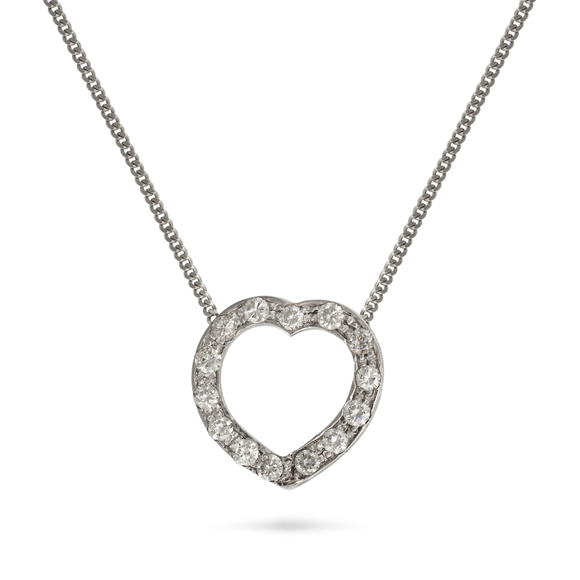 A DIAMOND HEART PENDANT NECKLACE in white gold, the pendant designed as a heart set with round br...