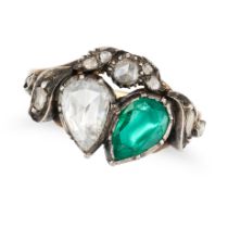 AN ANTIQUE EMERALD AND DIAMOND SWEETHEART RING in yellow gold and silver, set with a pear shaped ...
