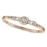 AN ANTIQUE VICTORIAN DIAMOND BANGLE in yellow gold, in a scrolling design set throughout with old...