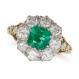 AN EMERALD AND DIAMOND CLUSTER RING in yellow gold, set with a cushion cut emerald of approximate...
