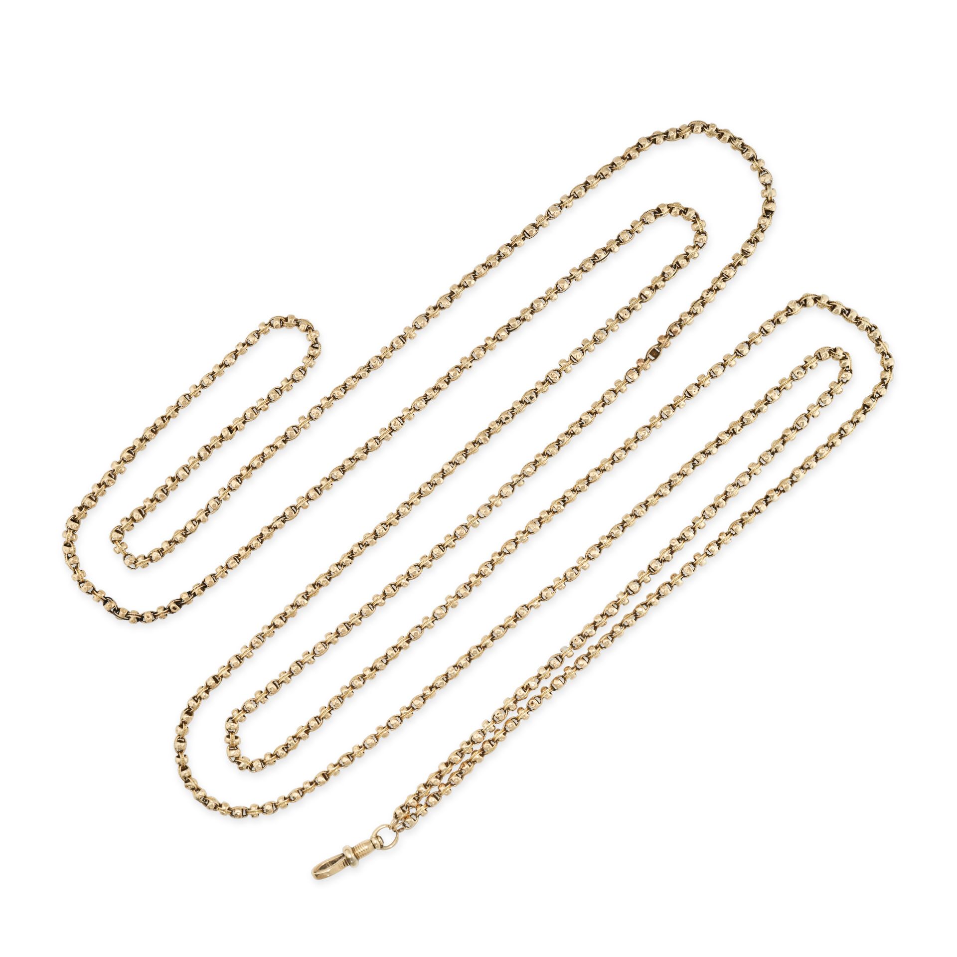 AN ANTIQUE EDWARDIAN LONG GUARD CHAIN in 9ct yellow gold, the fancy link chain terminating in a s...