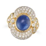 A SAPPHIRE AND DIAMOND DRESS RING in 18ct yellow gold, set with an oval cabochon cut sapphire of ...