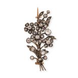 AN ANTIQUE DIAMOND SPRAY BROOCH in yellow gold and silver, designed as a spray of foliage set thr...