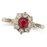 AN ANTIQUE RUBY AND DIAMOND CLUSTER RING in yellow gold and silver, set with a round cut ruby of ...