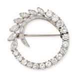 A DIAMOND BROOCH in platinum, designed as an open circle set with graduating round brilliant cut ...