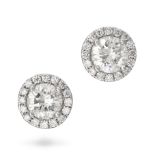 A PAIR OF DIAMOND HALO STUD EARRINGS in 18ct white gold, each set with a round brilliant cut diam...