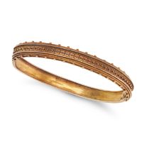 AN ANTIQUE VICTORIAN BANGLE in 15ct yellow gold, the bangle in an Etruscan revival design accente...