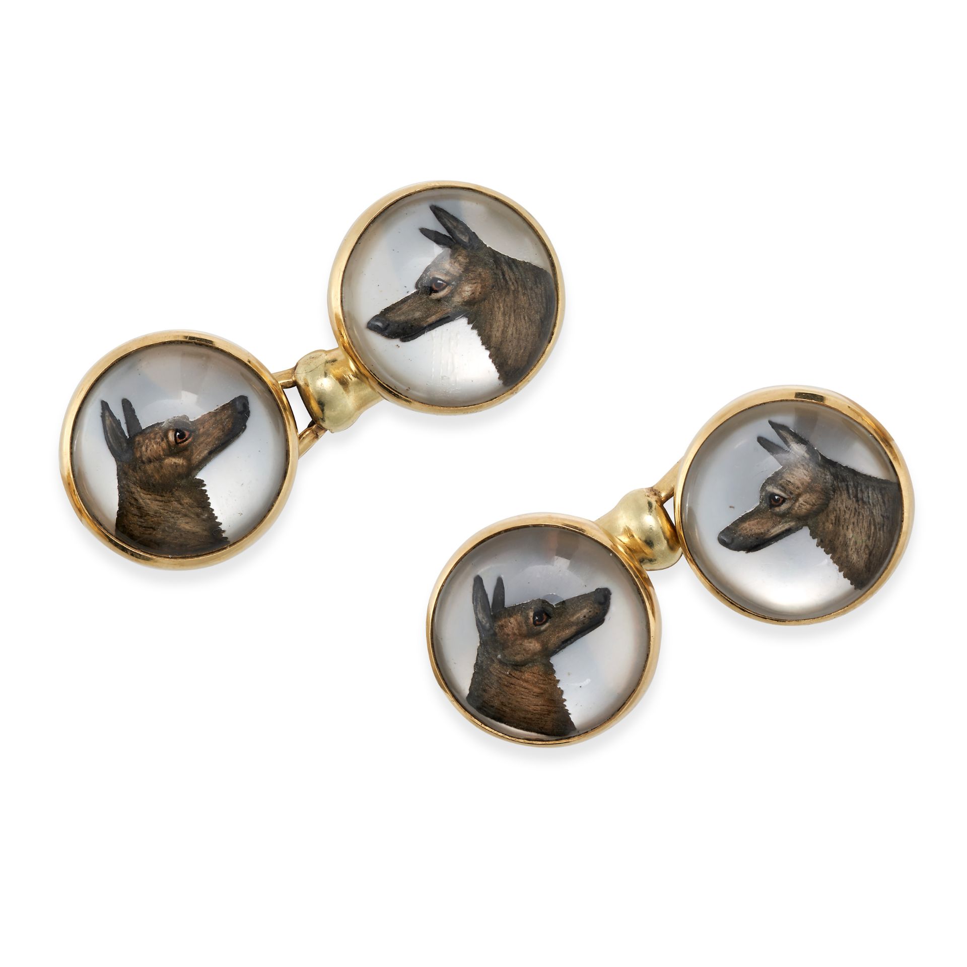 A PAIR OF ESSEX CRYSTAL DOG CUFFLINKS in 14ct yellow gold, the round faces set with an Essex crys...