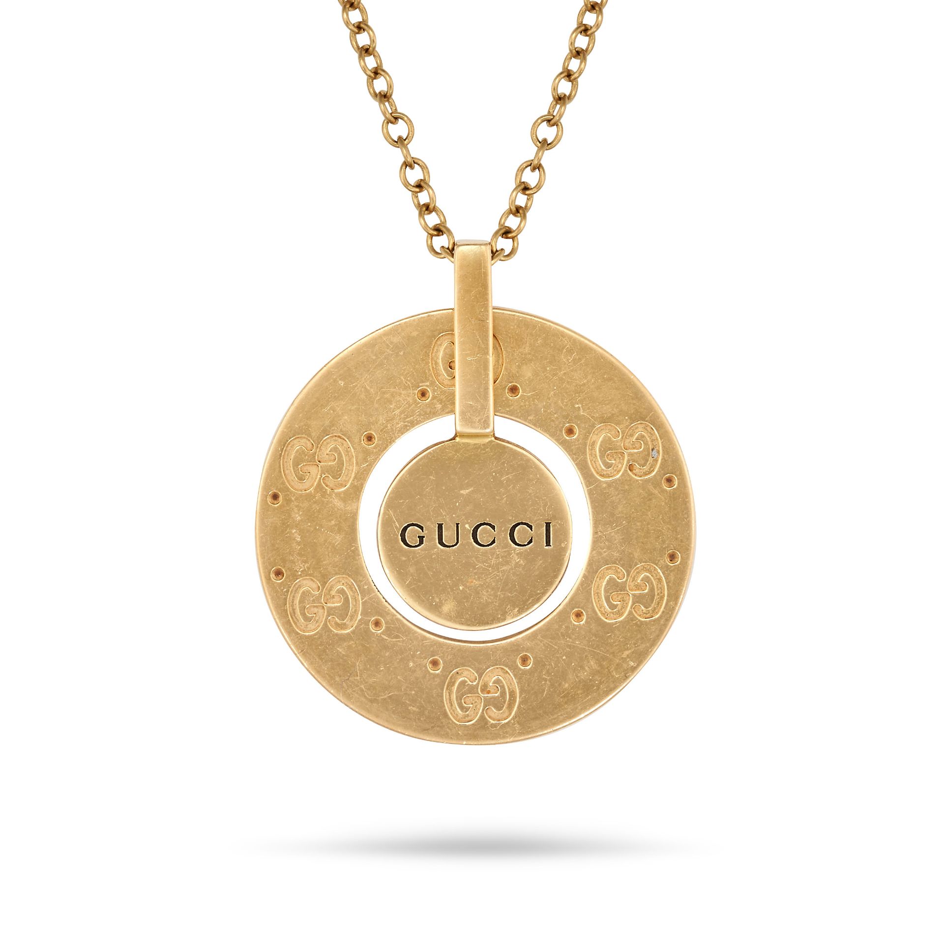 GUCCI, A LOGO NECKLACE in 18ct yellow gold, comprising a medallion engraved with the double G Guc...