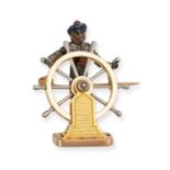 A FRENCH ENAMEL CAPTAIN BROOCH in 18ct yellow gold, designed as a ship captain steering a helm, t...