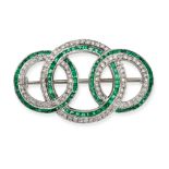 AN EMERALD AND DIAMOND CIRCLE BROOCH in white gold, designed as three interlocking circles, set w...