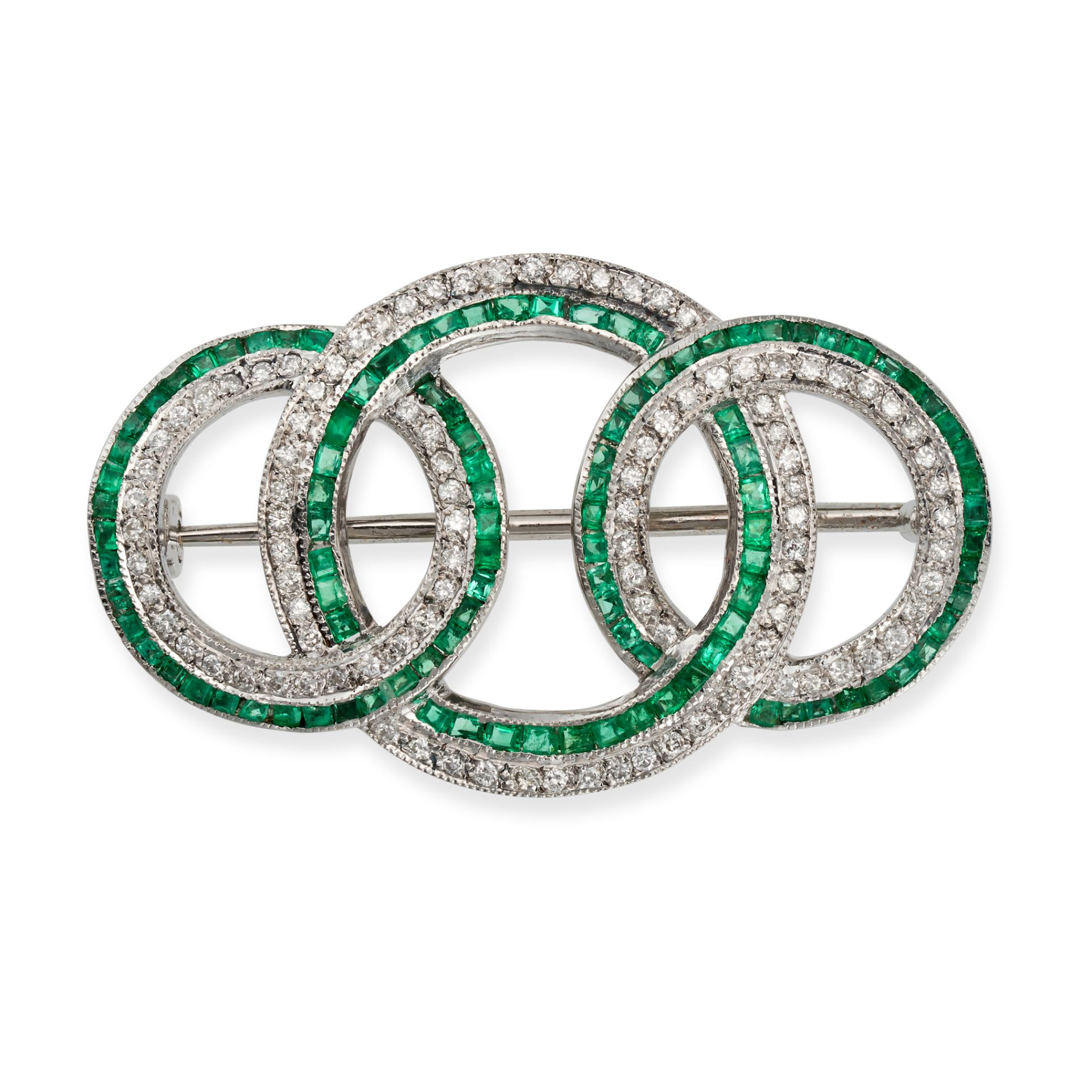 AN EMERALD AND DIAMOND CIRCLE BROOCH in white gold, designed as three interlocking circles, set w...