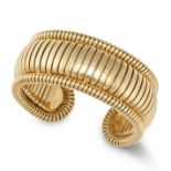 A CUFF BRACELET in 18ct yellow gold, the open cuff bracelet with a gas pipe style body, stamped 1...