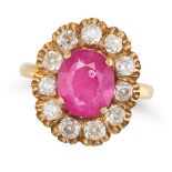 A RUBY AND DIAMOND CLUSTER RING in yellow gold, set with an oval cut ruby of approximately 5.01 c...