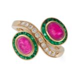 A RUBY, EMERALD AND DIAMOND TOI ET MOI RING in 14ct yellow gold, set with oval cabochon rubies in...