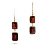 A PAIR OF GARNET DROP EARRINGS in 18ct yellow gold, each comprising a row of octagonal step cut g...