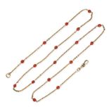 A CORAL CHAIN NECKLACE in yellow gold, the chain accented by round coral beads, no assay marks, 7...