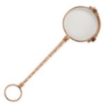 AN ANTIQUE GOLD LORGNETTE in yellow gold, the folding lenses on a tapering engraved handle, no as...
