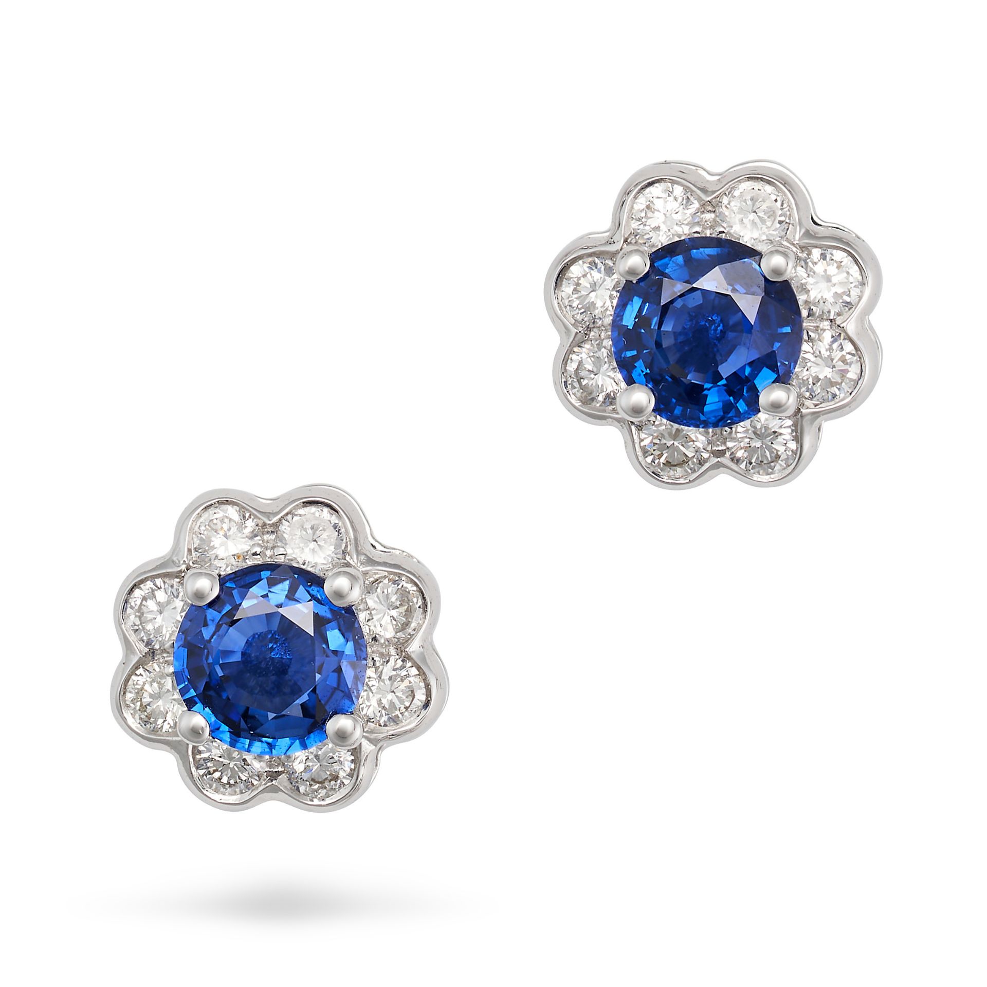 NO RESERVE - A PAIR OF SAPPHIRE AND DIAMOND CLUSTER EARRINGS in 18ct white gold, each set with a ...