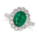 AN EMERALD AND DIAMOND CLUSTER RING in 18ct white gold, set with an oval cut emerald of 1.63 cara...