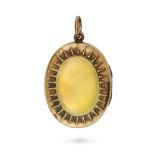 AN ANTIQUE YELLOW CHALCEDONY LOCKET PENDANT in 15ct yellow gold, the oval hinged locket set with ...