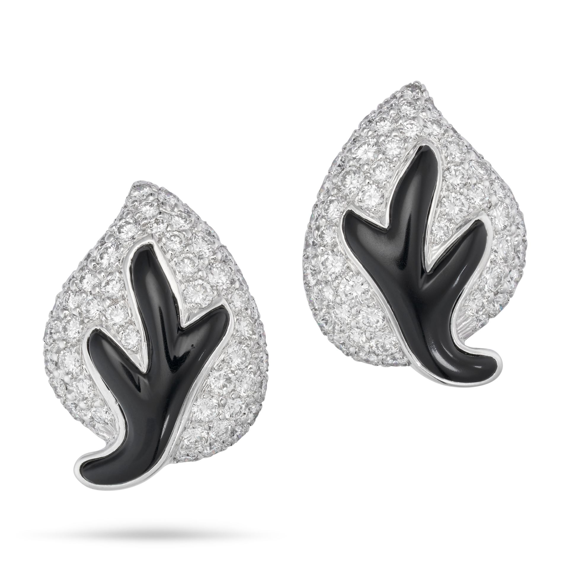 A PAIR OF ONYX AND DIAMOND LEAF CLIP EARRINGS in 18ct white gold, each designed as a leaf set wit...