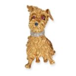 A GEMSET DOG BROOCH in yellow gold, designed as a terrier with ruby eyes, the nose set with a rou...
